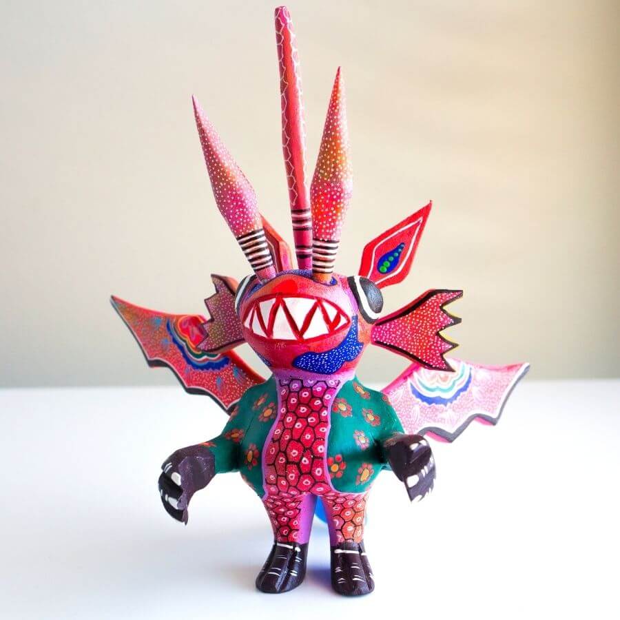 a hand painted dragon-inspired Alebrije, folkloric art 
