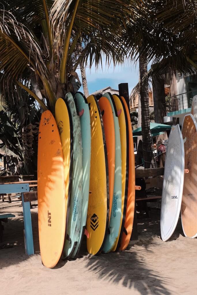 Surboards on a stand in Sayulita, one of Mexico's best beach towns for solo travelers!