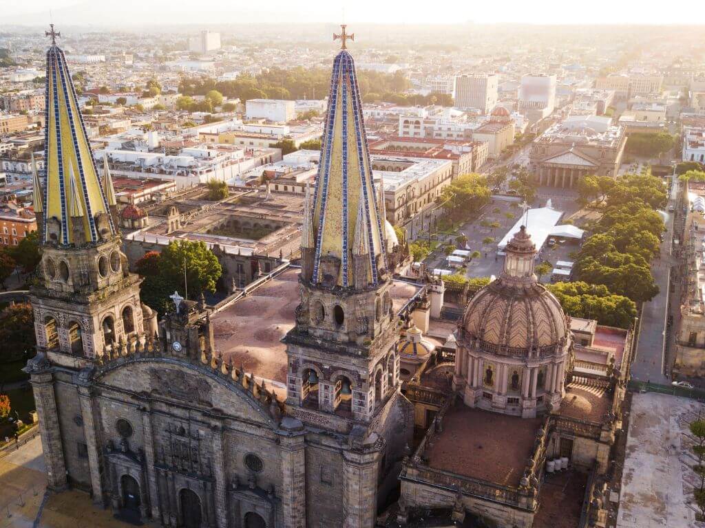 aerial photo of the main cathedral in guadalajara mexico, at golden hour