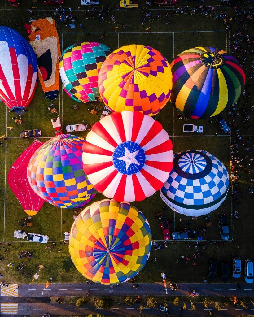 Colorful hot air balloons prepare for flight for the international balloon festival in león, mexico.