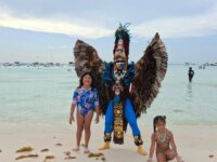 Playa norte, isla mujeres with a mayan descendant in costume